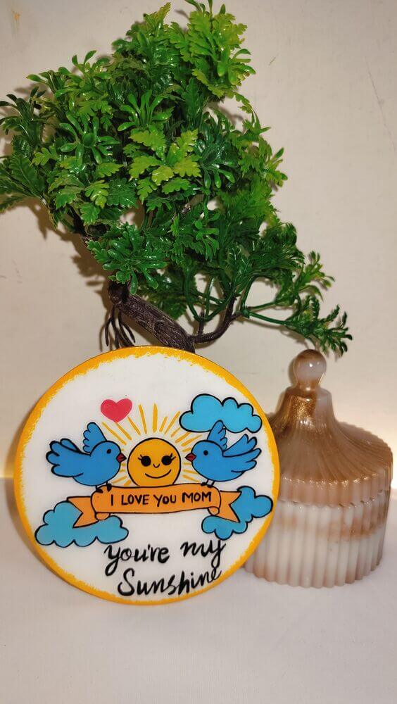 Adorable hand-painted "I Love You Mom" fridge magnet with birds, sun, and "you're my Sunshine" text. A perfect 4-inch Mother's Day gift with a glossy resin finish.
